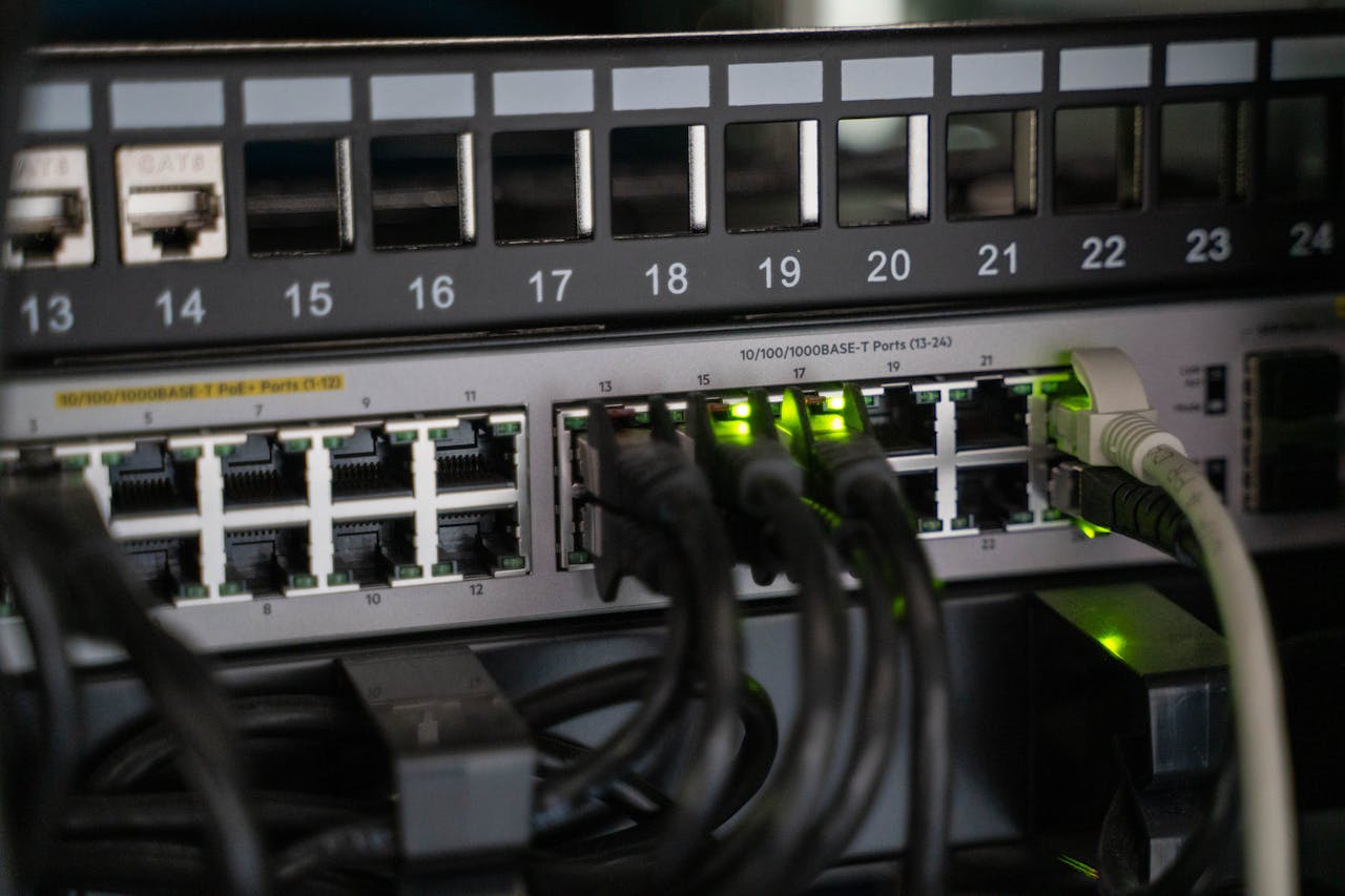 services-02 Networking equipment with connected cables, showcasing modern technology infrastructure.