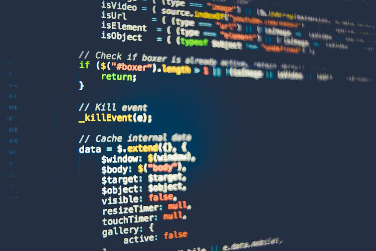 services-04 Close-up of colorful programming code displayed on a computer screen, showcasing modern coding concepts.
